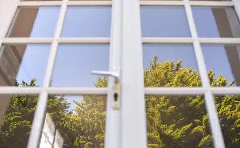 white metal framed glass window